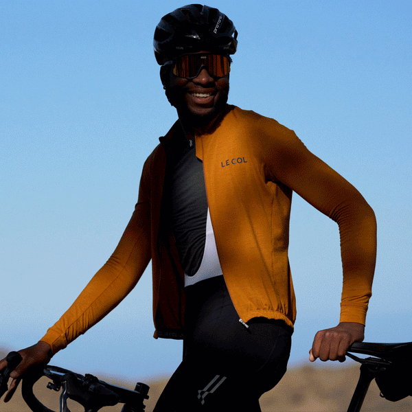 Rolling three images, lifestyle shots of male cyclists in grey merino baselayer.