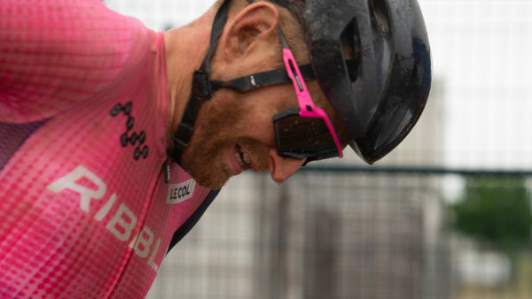 Ribble cyclist wearing a pink cycling jersey and black helmet