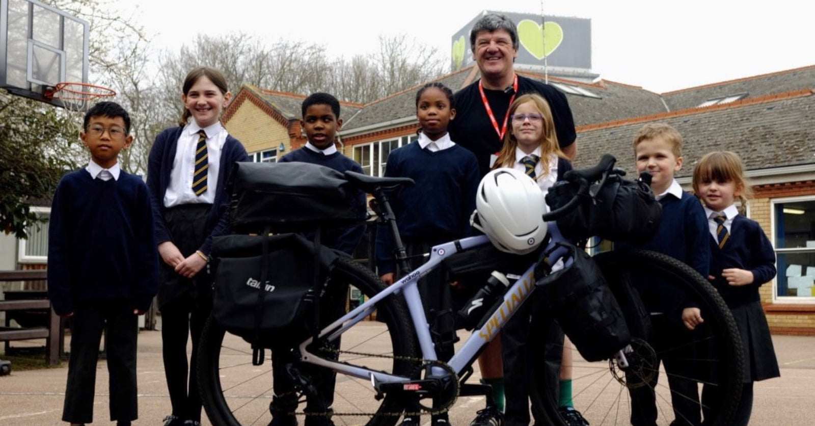 Stephan stood behind row of school children and his heavily loaded bike