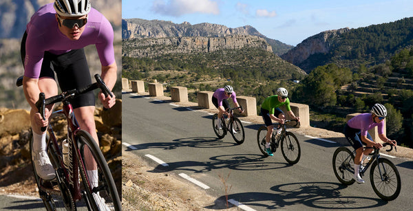 Three cyclists in new orchid and lawn green jerseys, with rocky mountainous background
