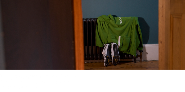 Jersey and cycling shoes dry against a radiator. 