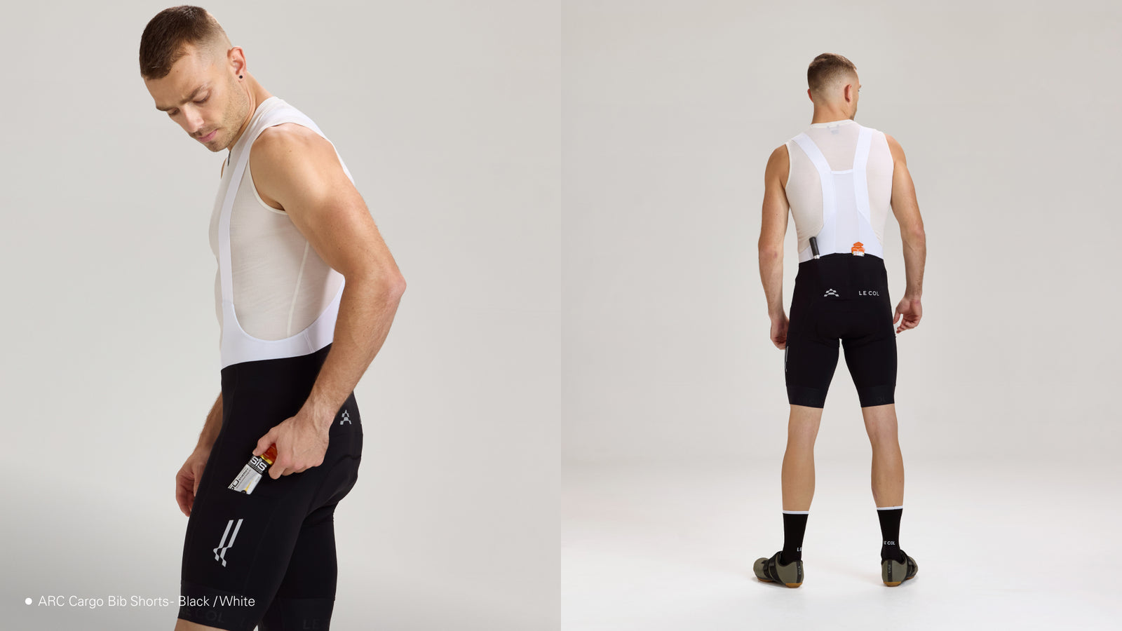 Studio shot of male wearing black bibshorts with white straps, showing off the pockets
