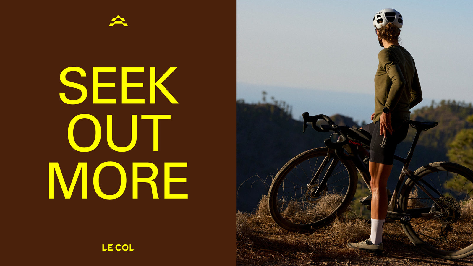 'Seek out more' Female rider looking out over hills.