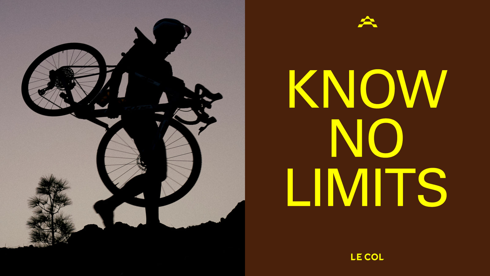 'Know no limits' silhouetted rider carrying their bike along a hill top.