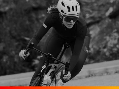 Cyclist in action on a road bike with a blurred background