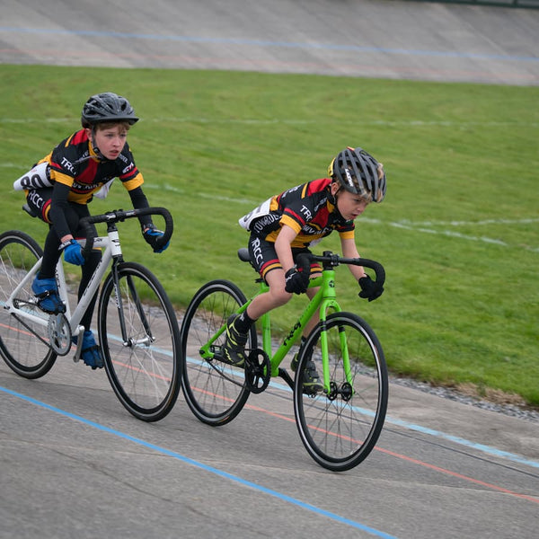 Two boys mid race wearing 'Towy Rider' Kit.