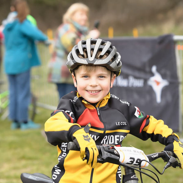 Smiling boy on his bike in 'Towy Riders' Kit. 
