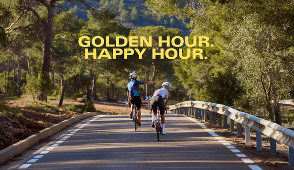 Male and female cyclist in new stripe pattern, lightweight jerseys, on a country road.