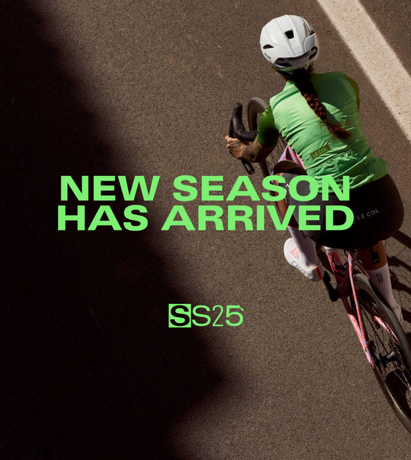 Birds eye view of female cyclist in new green jersey. 'New season has arrived'.