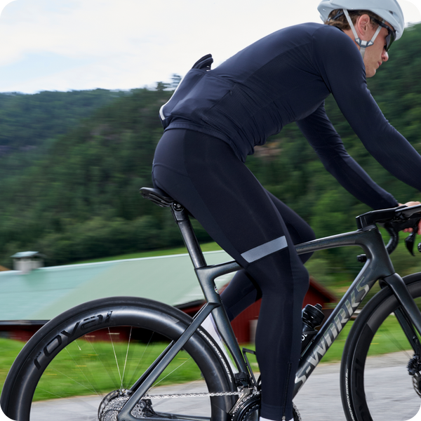 Male cyclist in Hors Categorie Bib tights and black long sleeve jersey.