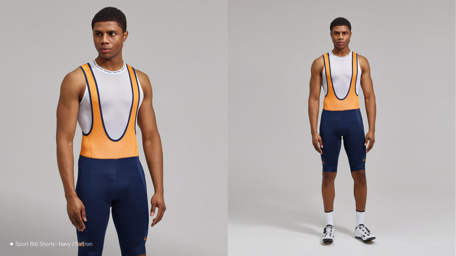Studio shot male wearing navy bibshorts with saffron straps trimmed with navy