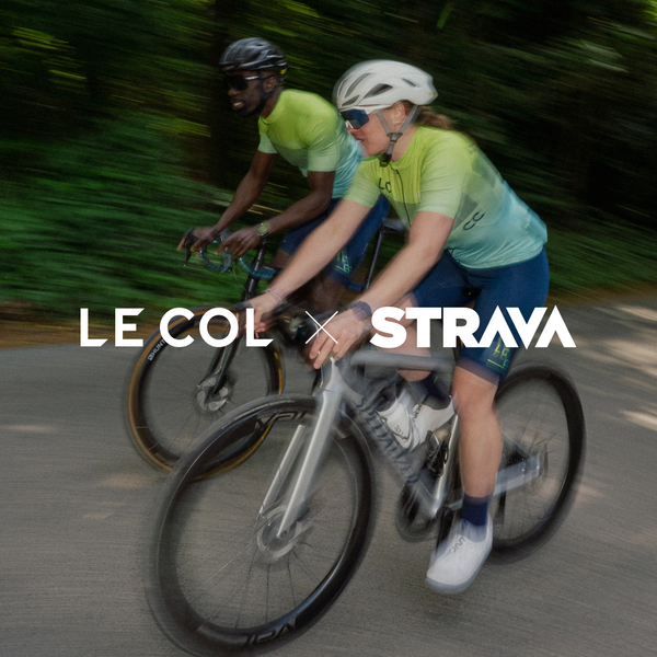 Slightly blurred male and female cyclist in turquoise fade LC__CC jerseys 