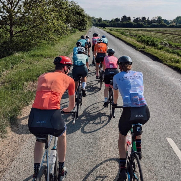 Shot from the back of the cycling group on a country road.
