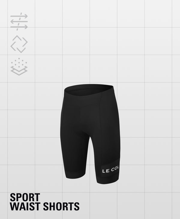 Black high-waited shorts and Le Col printed horizontally just above the cuff