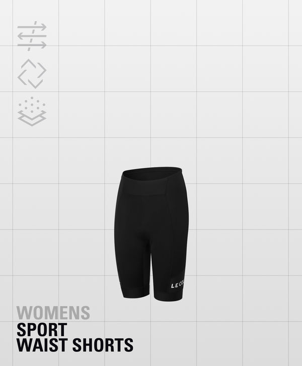 Black high-waited shorts and Le Col printed horizontally just above the cuff